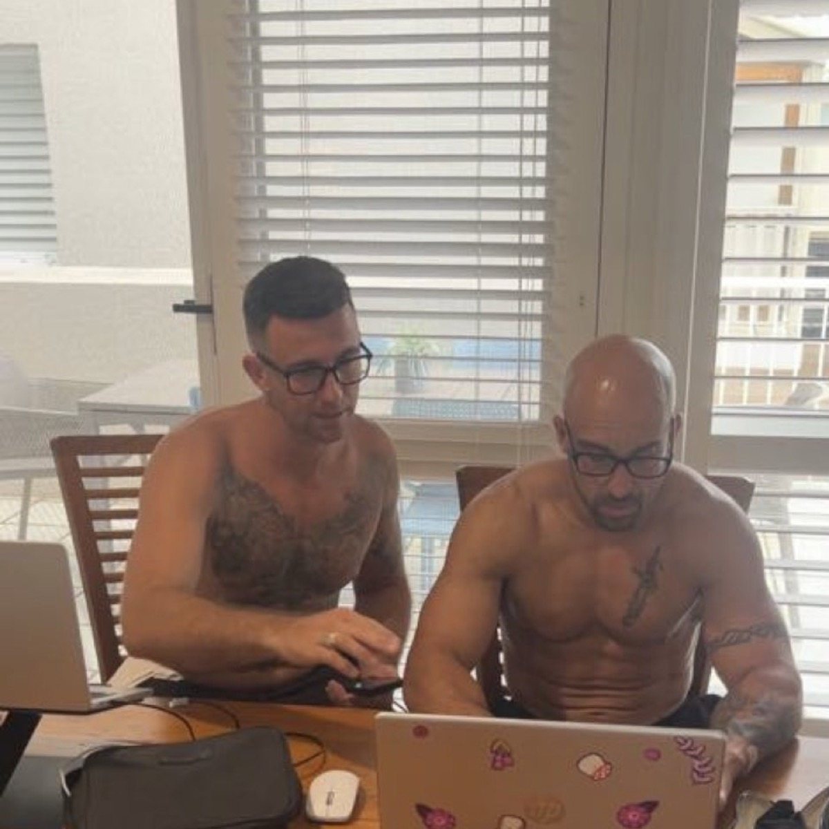 Camo working at a laptop.