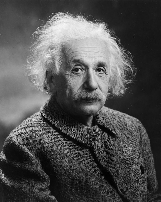 Albert Einstein in 1947: a black-and-white portrait, wild white hair, looking straight down the lens.